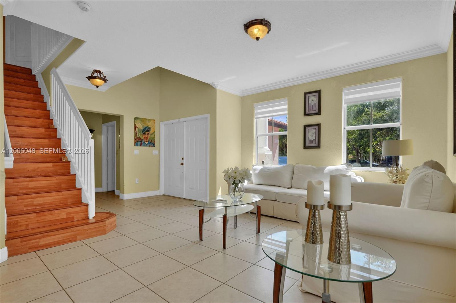 6114 Southwest 158th Pass Miami, FL 33193 - Photo 6 of 37 a living room with furniture and a fireplace