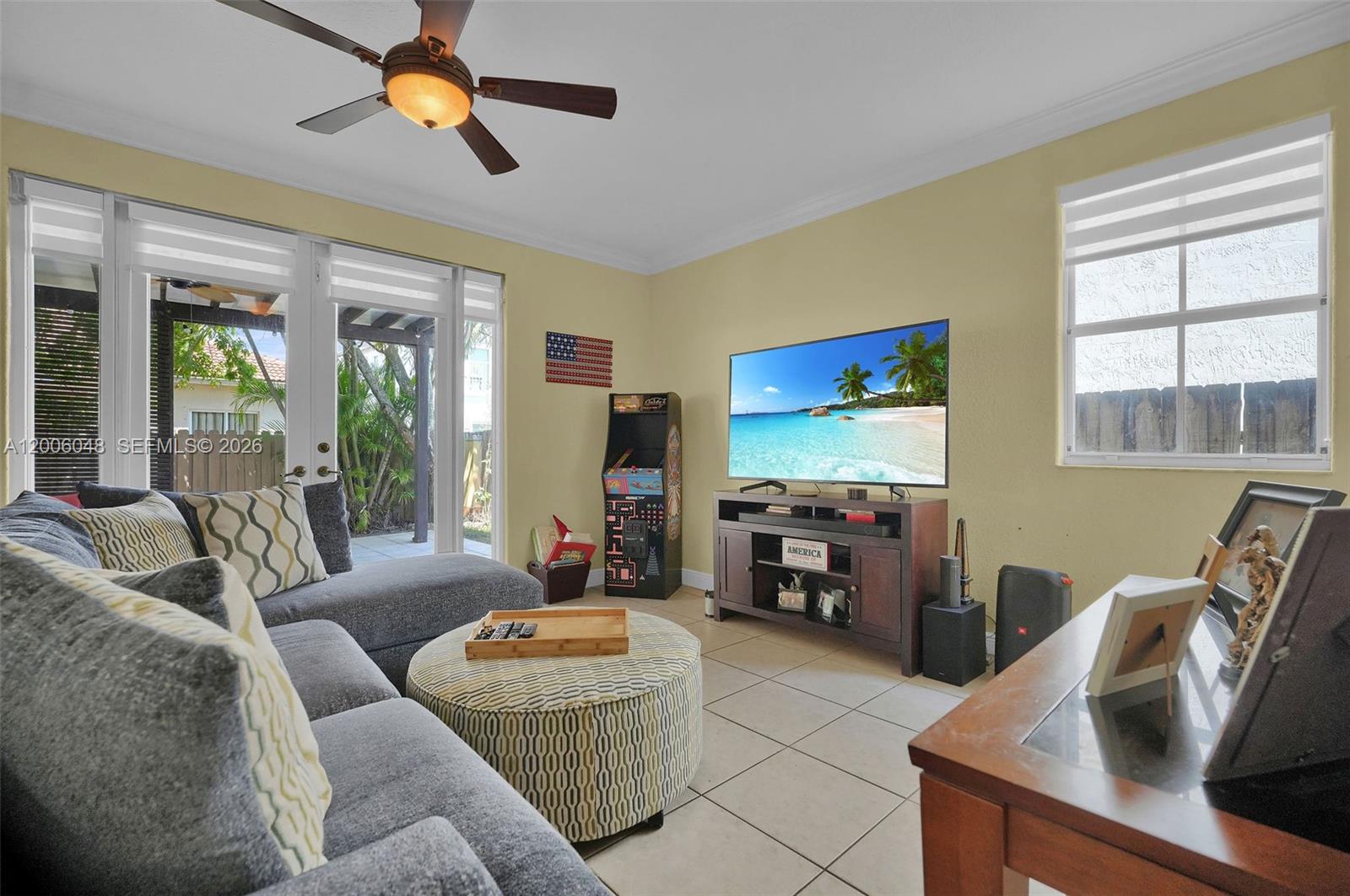 6114 Southwest 158th Pass Miami, FL 33193 - Photo 9 of 37 a living room with furniture and a flat screen tv