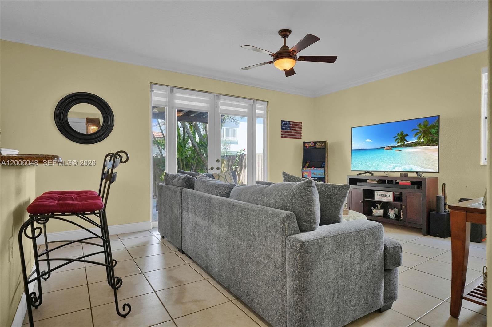 6114 Southwest 158th Pass Miami, FL 33193 - Photo 10 of 37 a living room with furniture and a large window