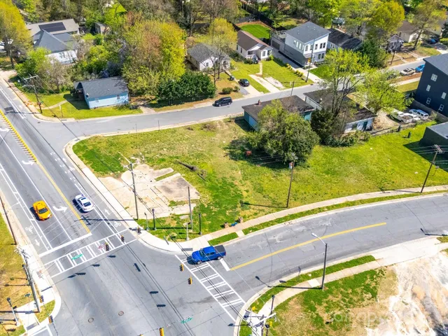 an aerial view of a house with a swimming pool
