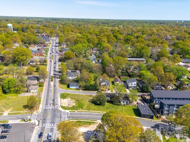 an aerial view of residential houses and outdoor space