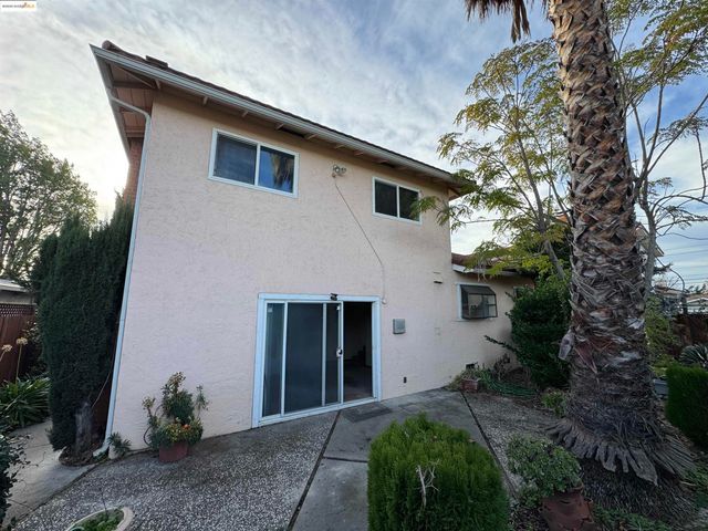 a view of a back yard from a corridor