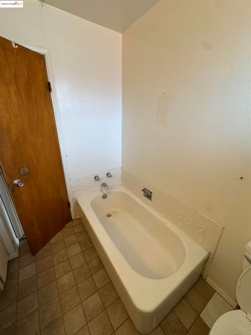 an empty room with a bathroom