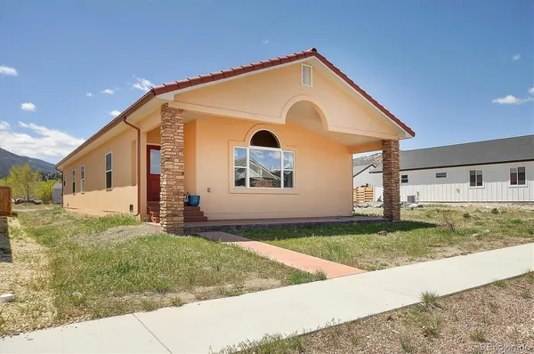 a front view of a house with a yard