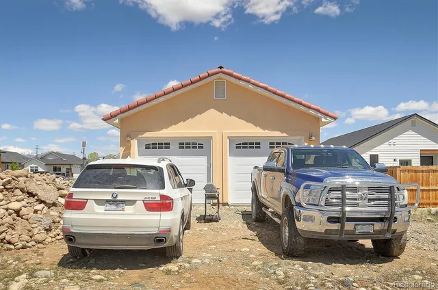 a view of a car in front of a house