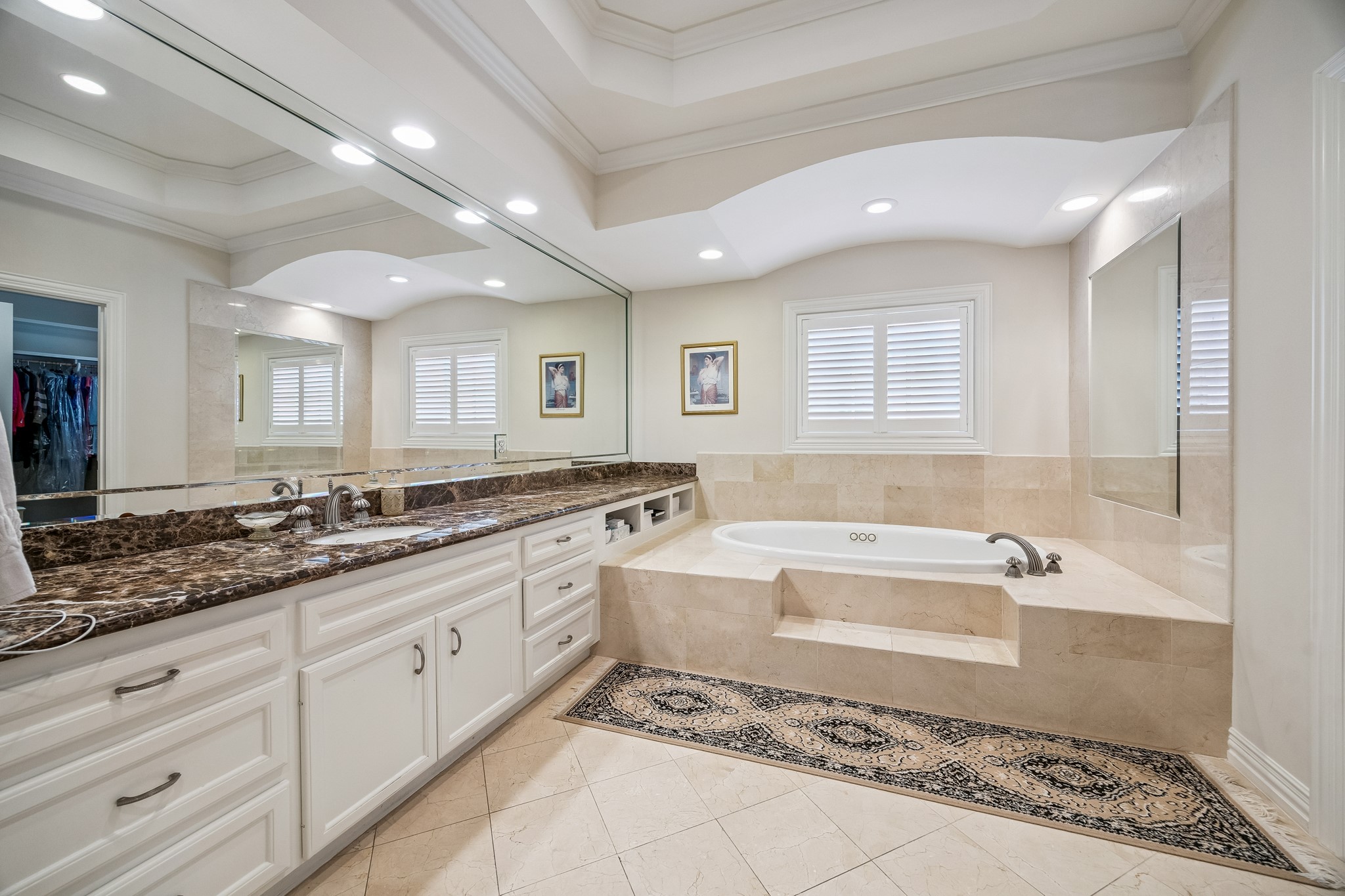 5043 Tangle Lane Houston, TX 77056 - Photo 24 of 50 a spacious bathroom with a tub sink and mirror