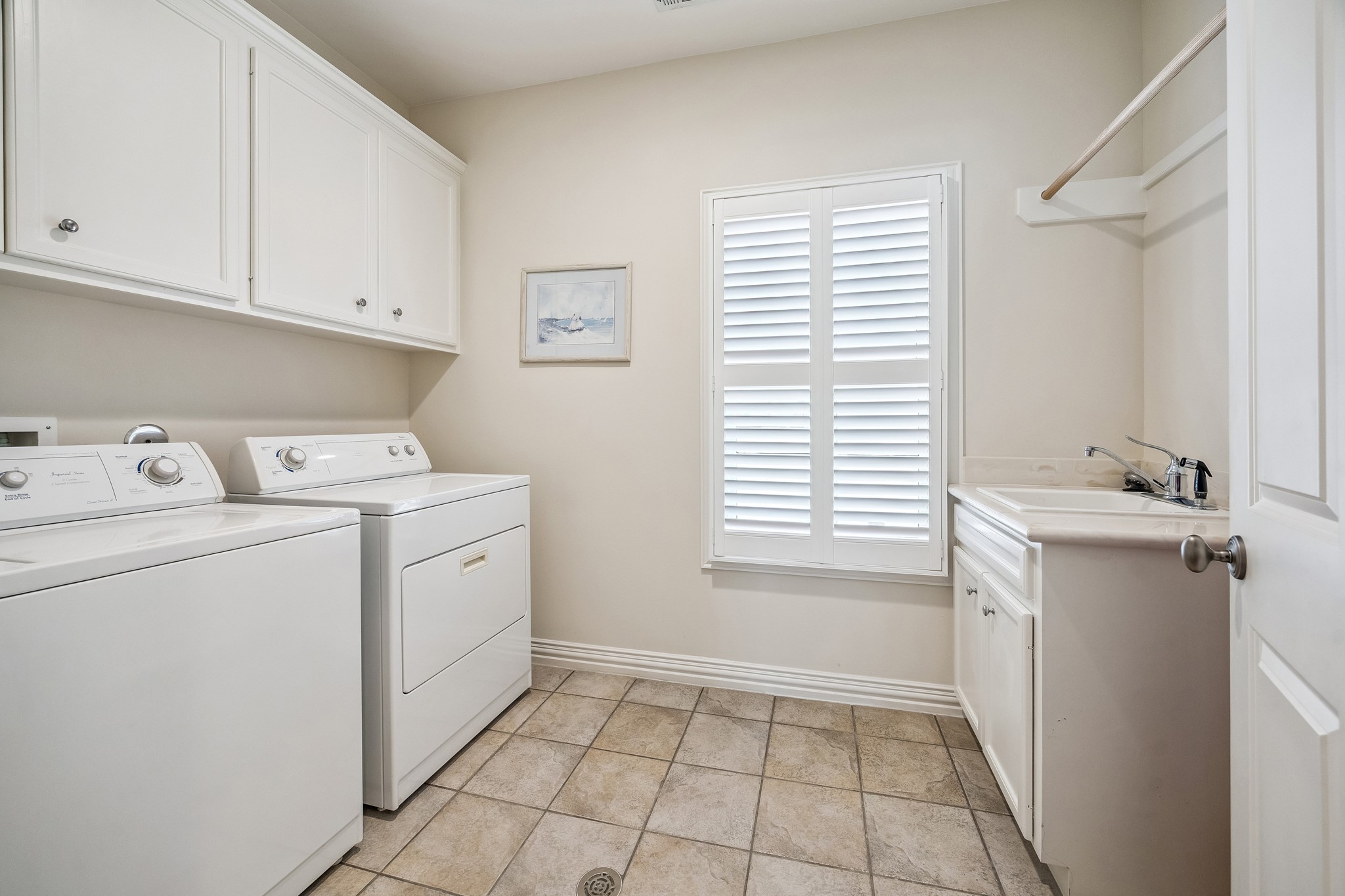 5043 Tangle Lane Houston, TX 77056 - Photo 29 of 50 a utility room with closet dryer and washer