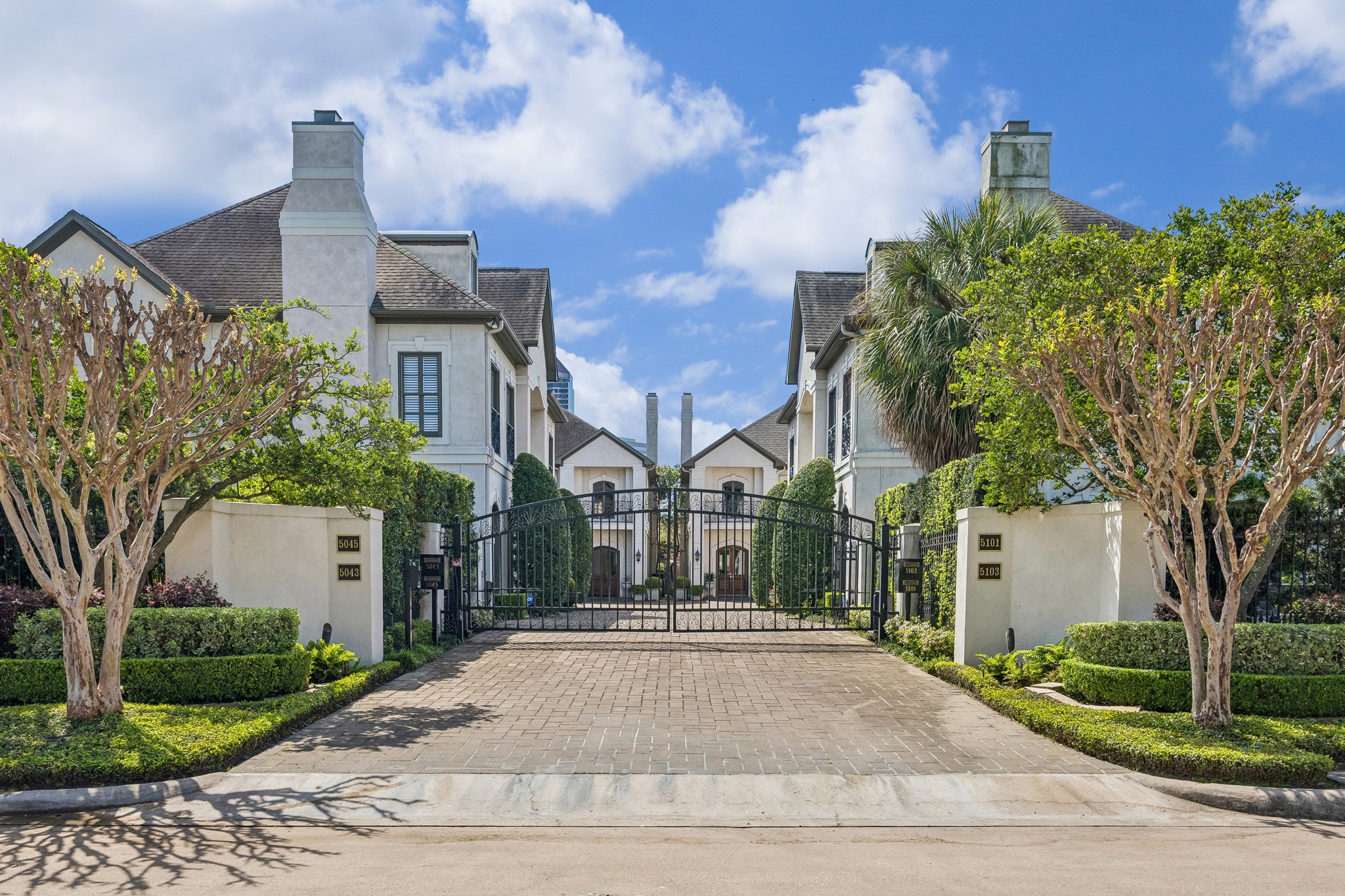 5043 Tangle Lane Houston, TX 77056 - Photo 36 of 50 a front view of a house with a yard and fountain in middle