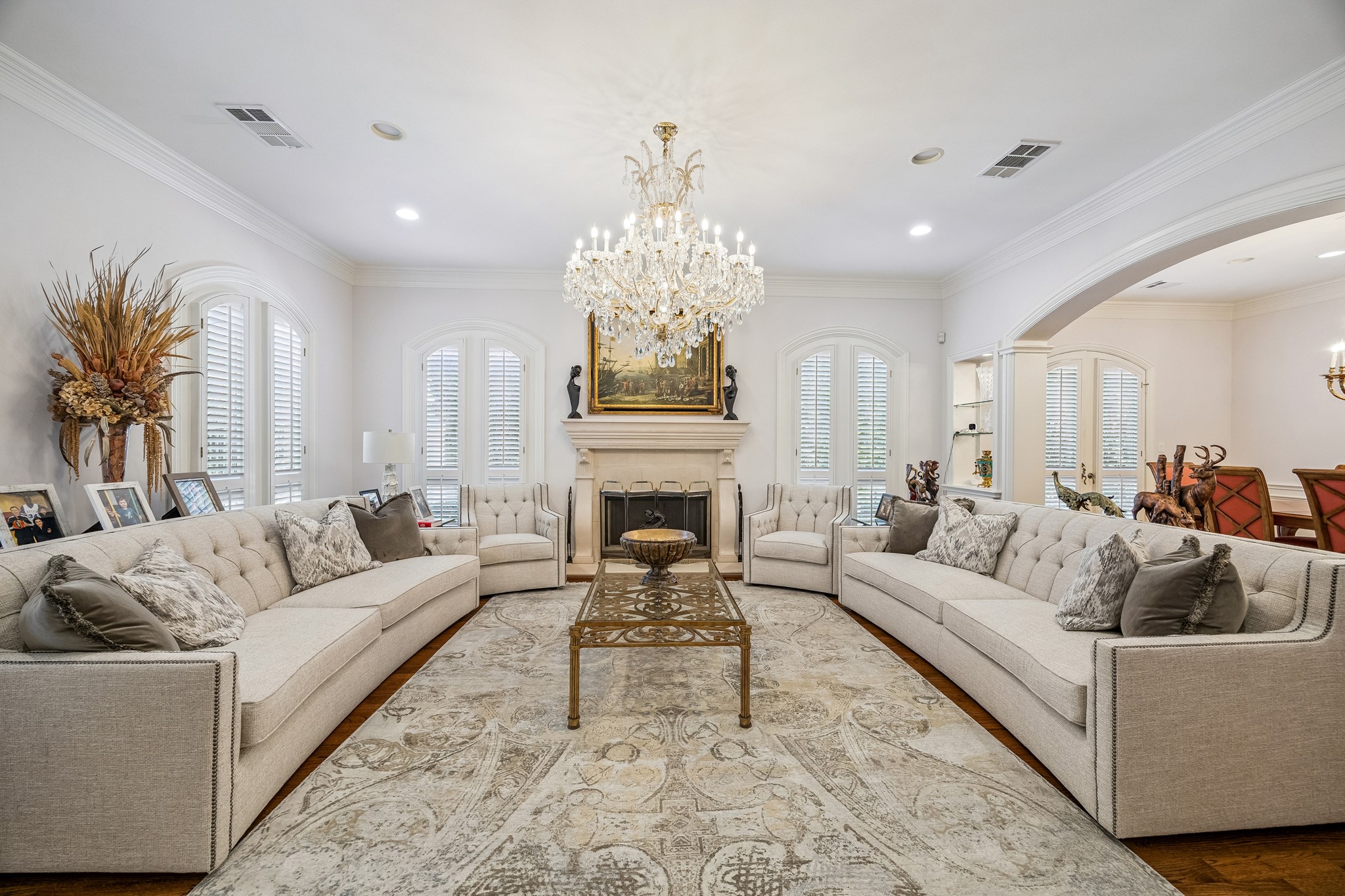 5043 Tangle Lane Houston, TX 77056 - Photo 5 of 50 a living room with furniture a fireplace and a chandelier