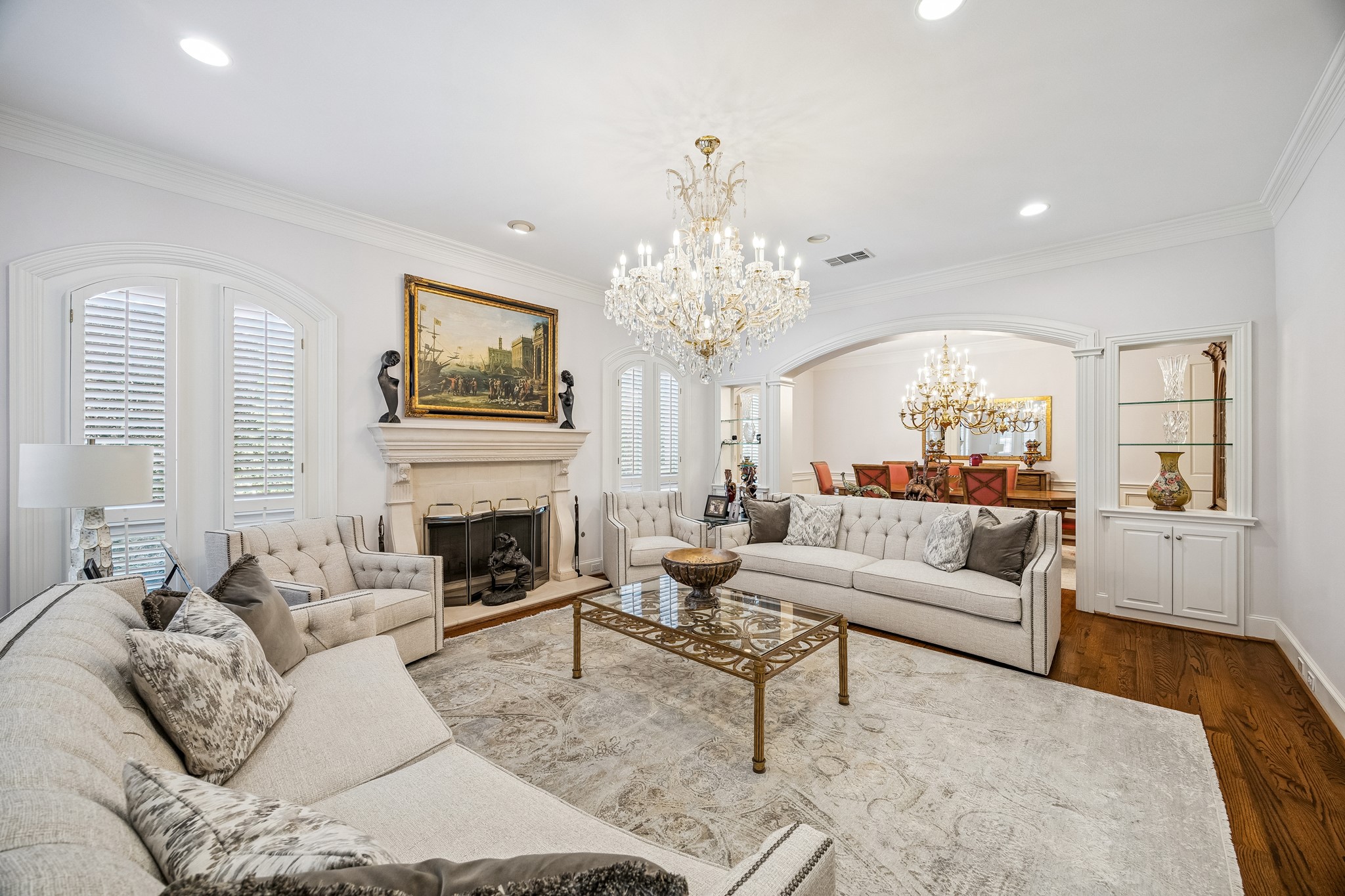 5043 Tangle Lane Houston, TX 77056 - Photo 6 of 50 a living room with furniture a fireplace and a chandelier