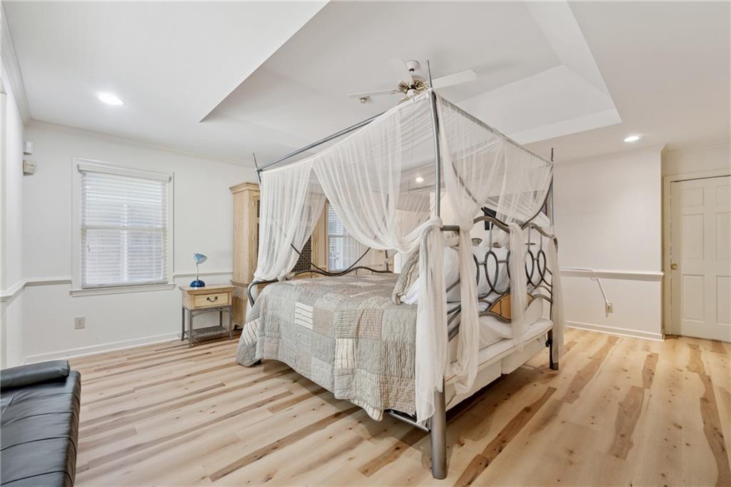 1387 Springdale Road Gainesville, GA 30501 - Photo 20 of 46 a white bed sitting in a room next to a white bed