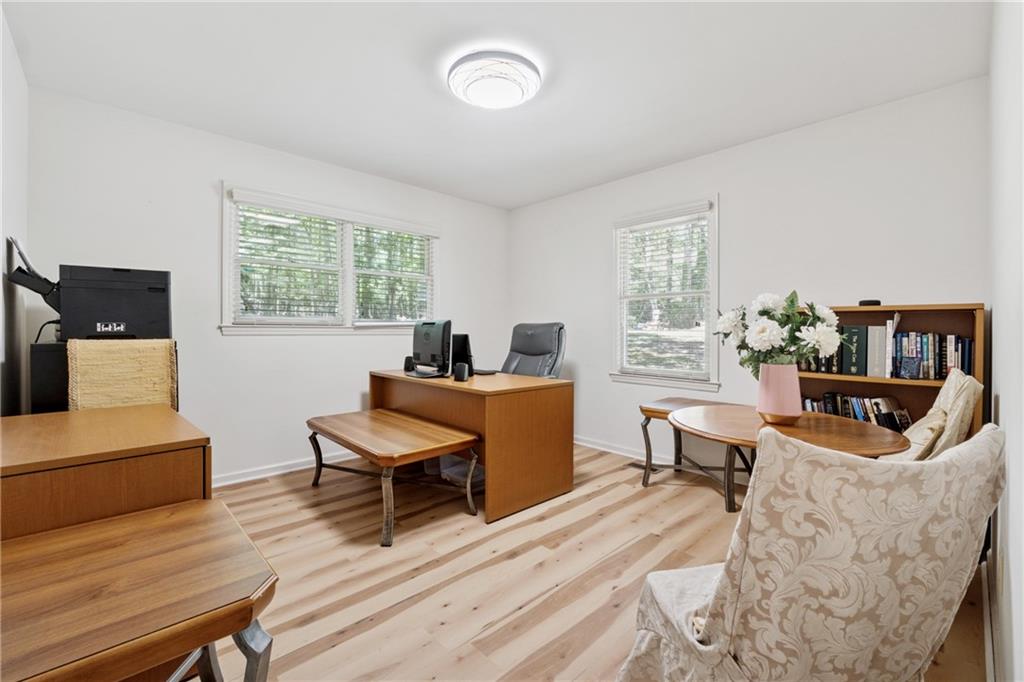 1387 Springdale Road Gainesville, GA 30501 - Photo 21 of 46 a living room with furniture and a wooden floor