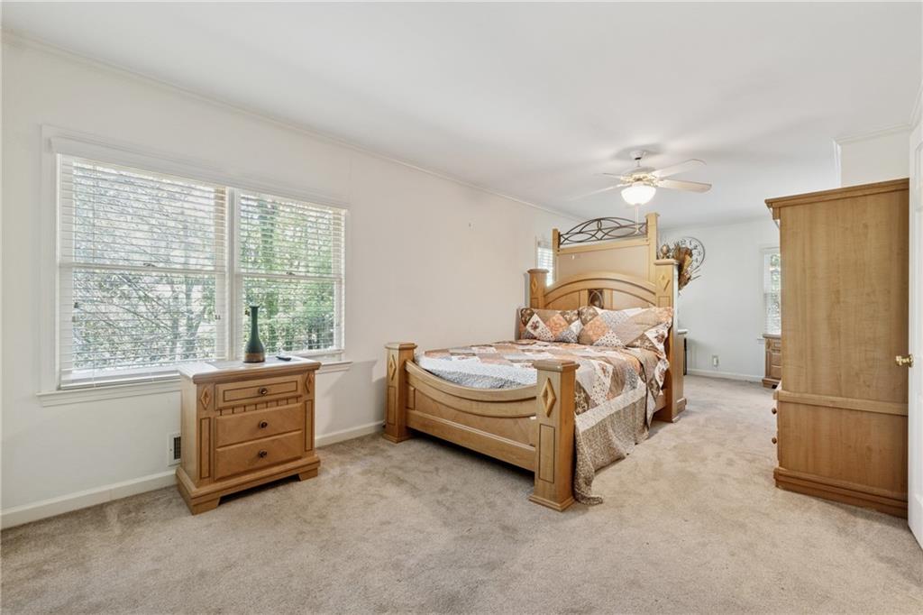 1387 Springdale Road Gainesville, GA 30501 - Photo 24 of 46 a bedroom with a bed and a window