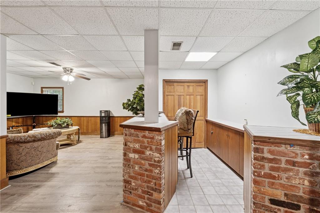 1387 Springdale Road Gainesville, GA 30501 - Photo 33 of 46 a living room with furniture and a flat screen tv