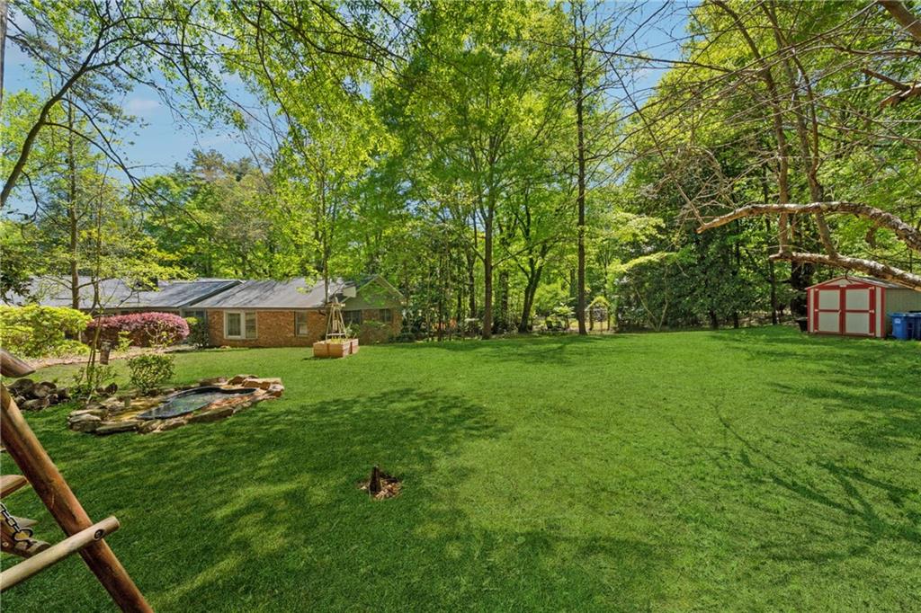 1387 Springdale Road Gainesville, GA 30501 - Photo 39 of 46 a view of a house with a backyard