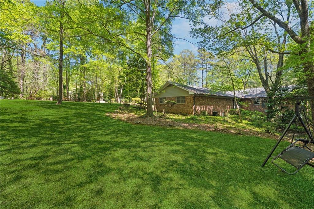 1387 Springdale Road Gainesville, GA 30501 - Photo 40 of 46 a front view of a house with a yard