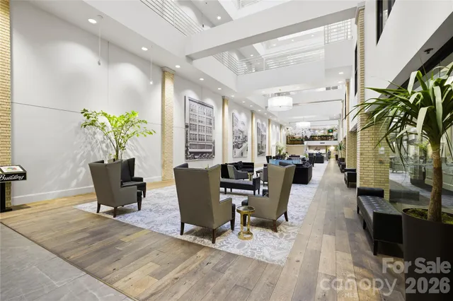 a living room with lots of furniture and a table