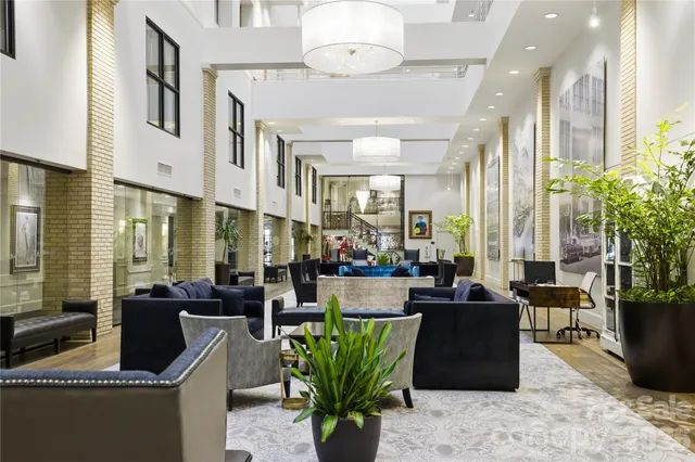 a living room with fireplace furniture and a flat screen tv