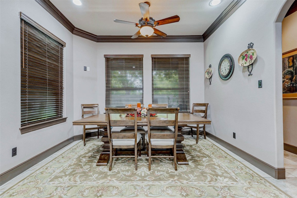 4315 Wickby Street Fulshear, TX 77441 - Photo 20 of 46 a dining room with wooden floor and a window