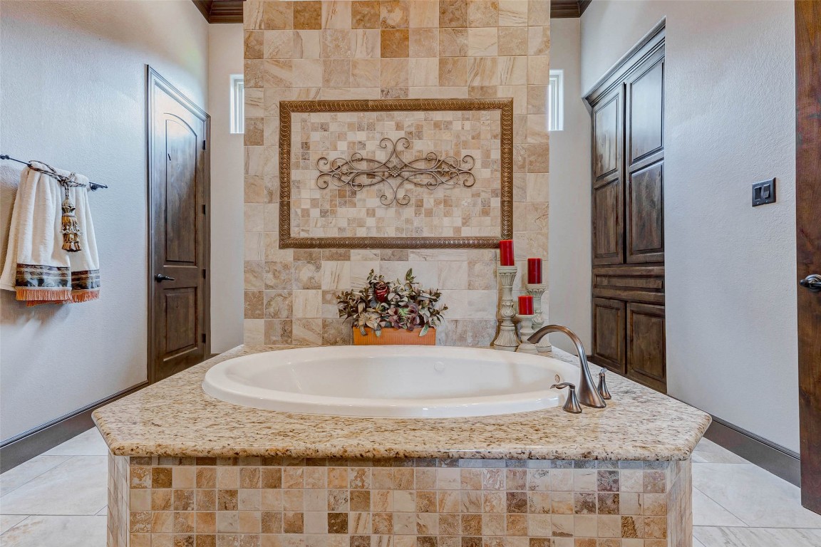 4315 Wickby Street Fulshear, TX 77441 - Photo 33 of 46 a bathroom with a granite countertop sink and a mirror