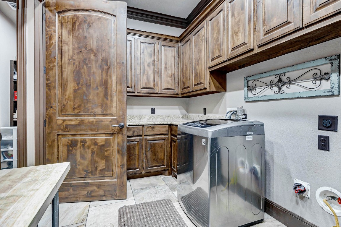 4315 Wickby Street Fulshear, TX 77441 - Photo 40 of 46 a kitchen with stainless steel appliances granite countertop a refrigerator and a stove