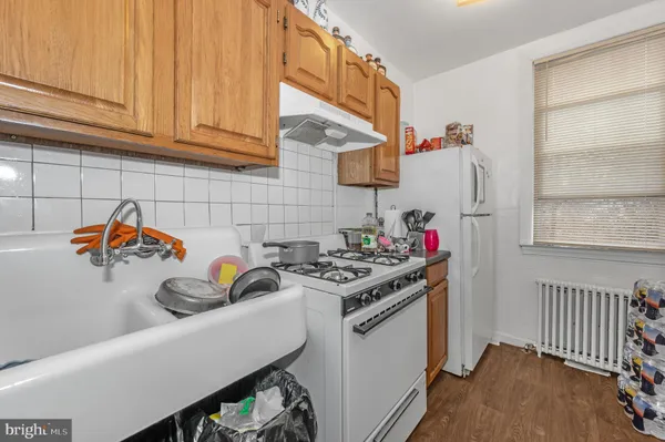 a kitchen with a sink cabinets and appliances