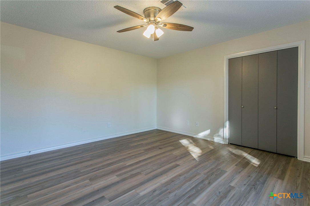 608 Ridgecrest Drive Salado, TX 76571 - Photo 23 of 43 a view of empty room with wooden floor