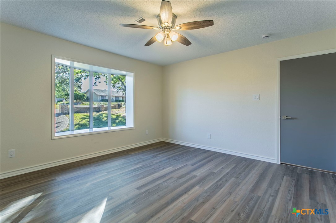608 Ridgecrest Drive Salado, TX 76571 - Photo 28 of 43 a view of a room with a window and wooden floor