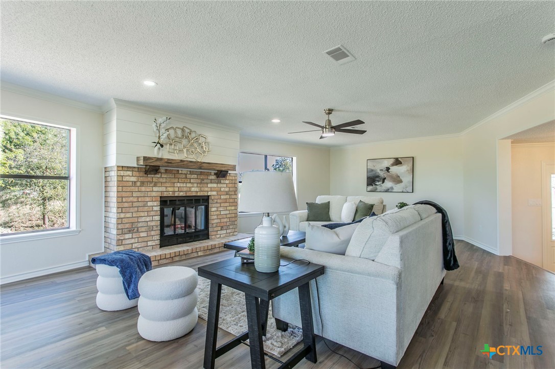 608 Ridgecrest Drive Salado, TX 76571 - Photo 6 of 43 a living room with furniture and a fireplace