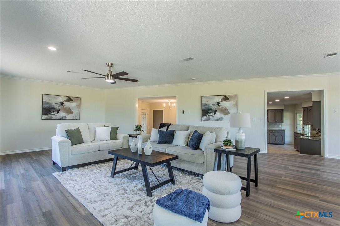 608 Ridgecrest Drive Salado, TX 76571 - Photo 7 of 43 a living room with furniture and a wooden floor