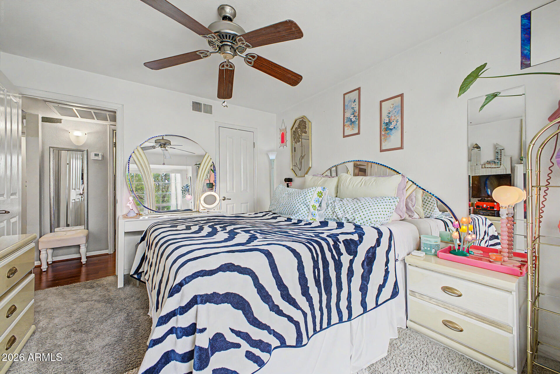 200 East Southern Avenue, Unit 224 Tempe, AZ 85282 - Photo 14 of 30 a bedroom with a bed and a chandelier