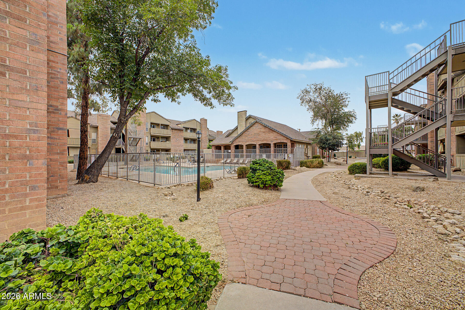 200 East Southern Avenue, Unit 224 Tempe, AZ 85282 - Photo 24 of 30 a front view of a house with a yard and garage