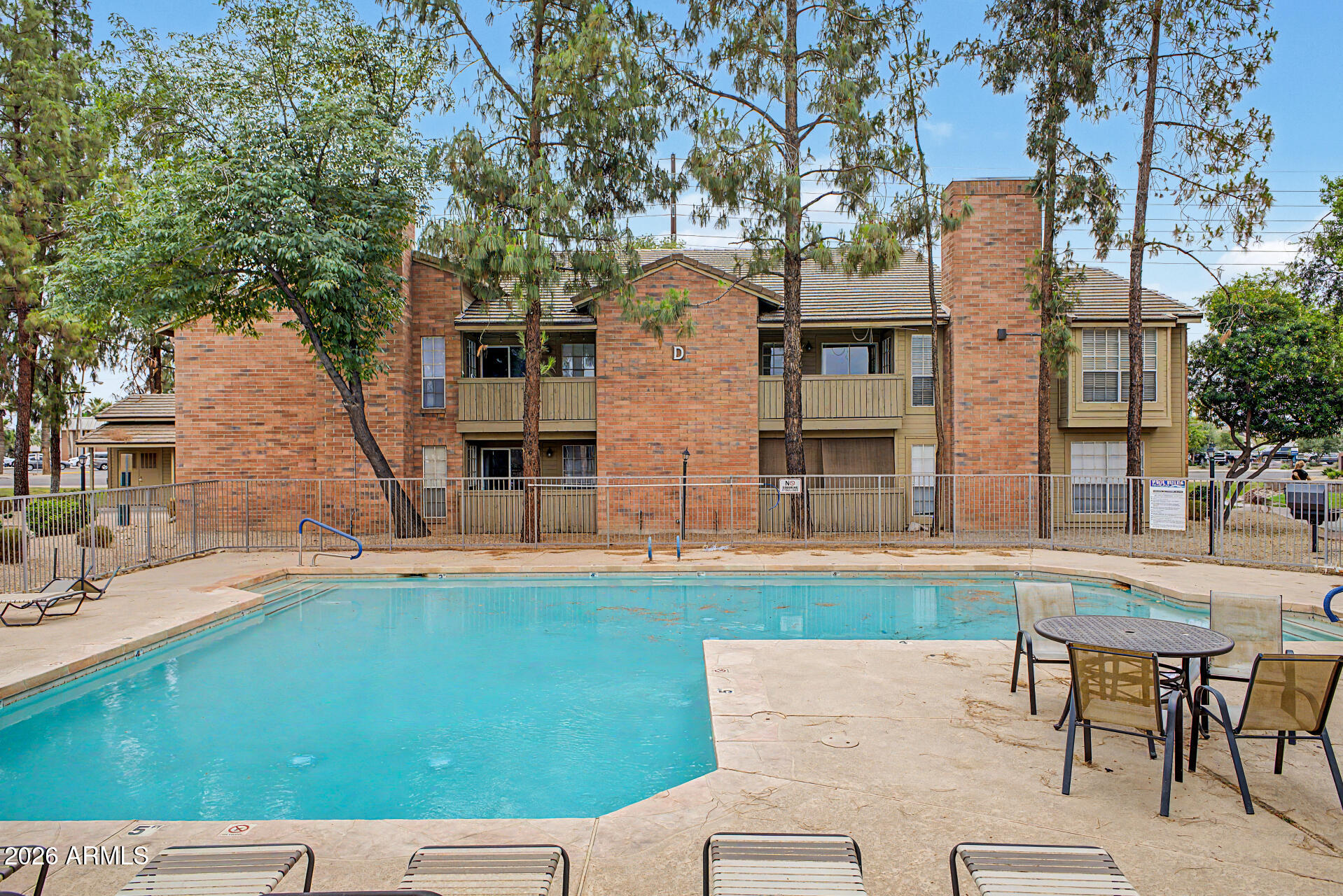 200 East Southern Avenue, Unit 224 Tempe, AZ 85282 - Photo 5 of 30 a view of a house with pool and chairs
