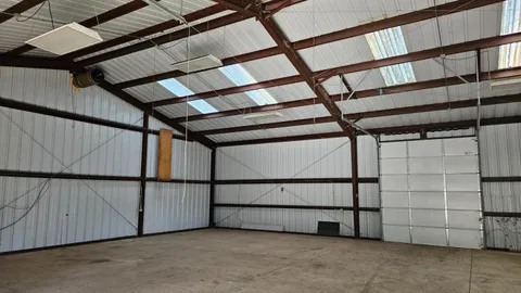 a view of an empty room with a ceiling fan