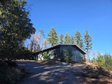 a view of a back yard of the house
