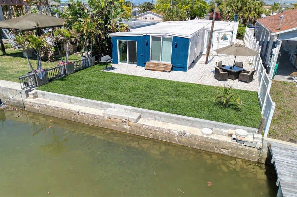 6820 Sea Ranch Drive Hudson, FL 34667 - Photo 20 of 29 a view of a house with a yard patio and swimming pool