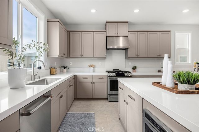 a kitchen with cabinets and window