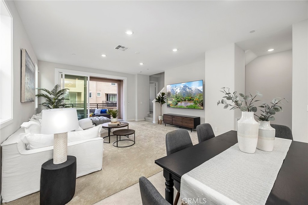 125 Pattern Irvine, CA 92618 - Photo 15 of 38 a living room with fireplace furniture and a potted plant