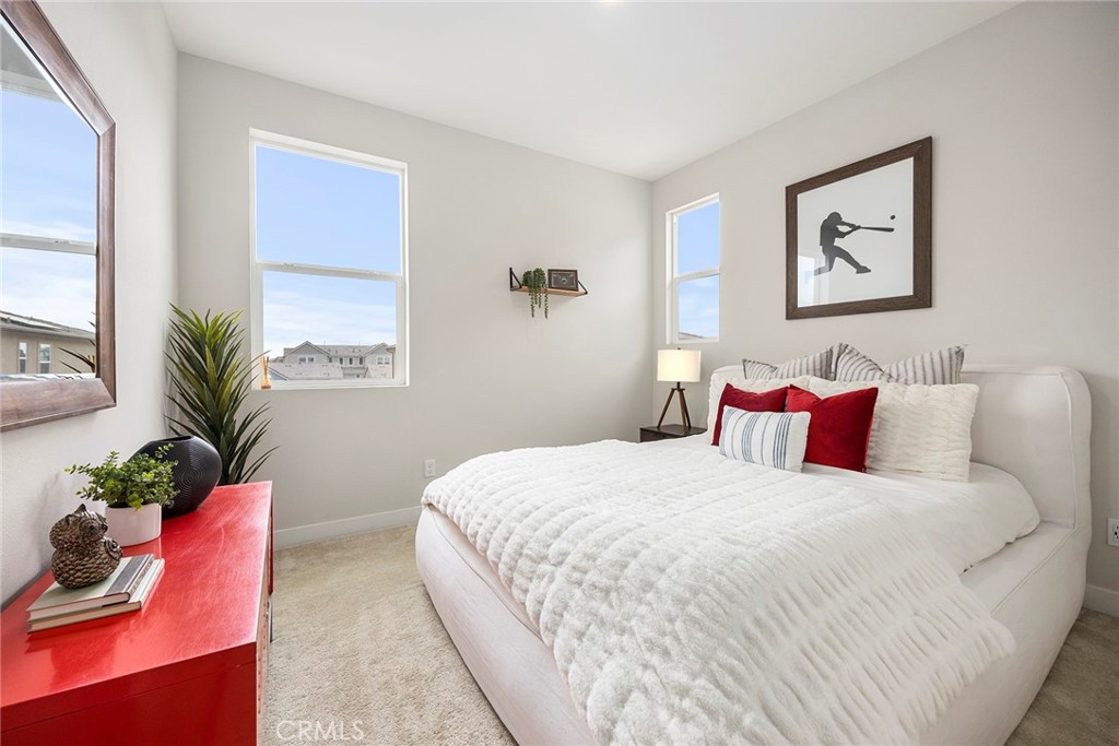 125 Pattern Irvine, CA 92618 - Photo 25 of 38 a bedroom with a bed and a potted plant