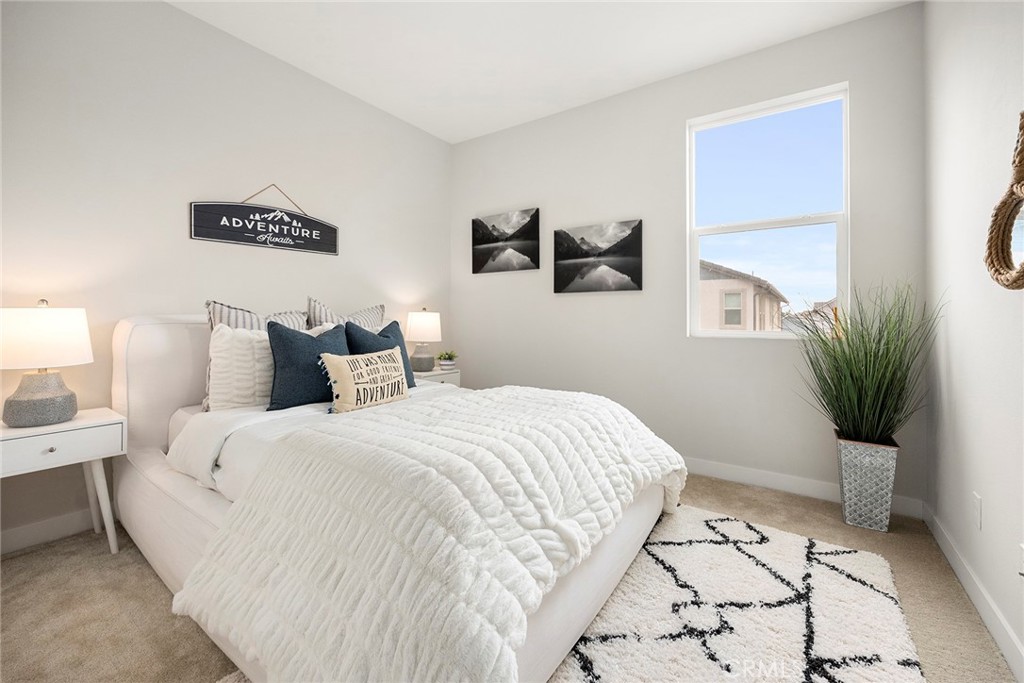 125 Pattern Irvine, CA 92618 - Photo 27 of 38 a bedroom with a bed and a potted plant
