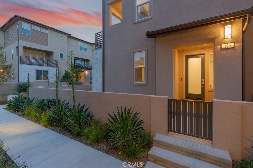 125 Pattern Irvine, CA 92618 - Photo 3 of 38 a view of a house with a small yard and plants