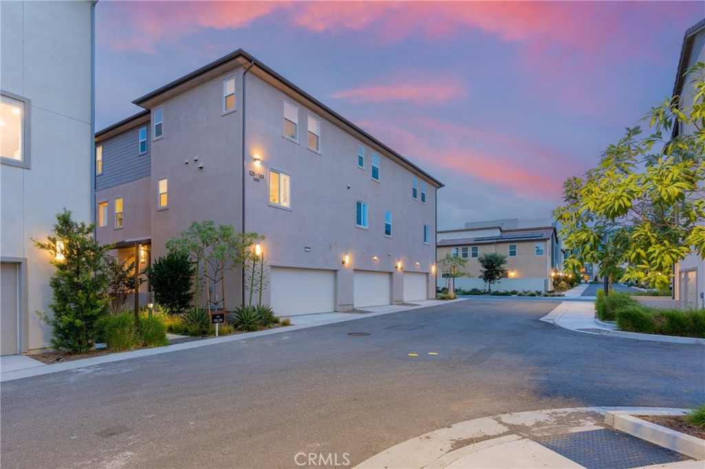 125 Pattern Irvine, CA 92618 - Photo 33 of 38 a front view of a house with a yard and a garage