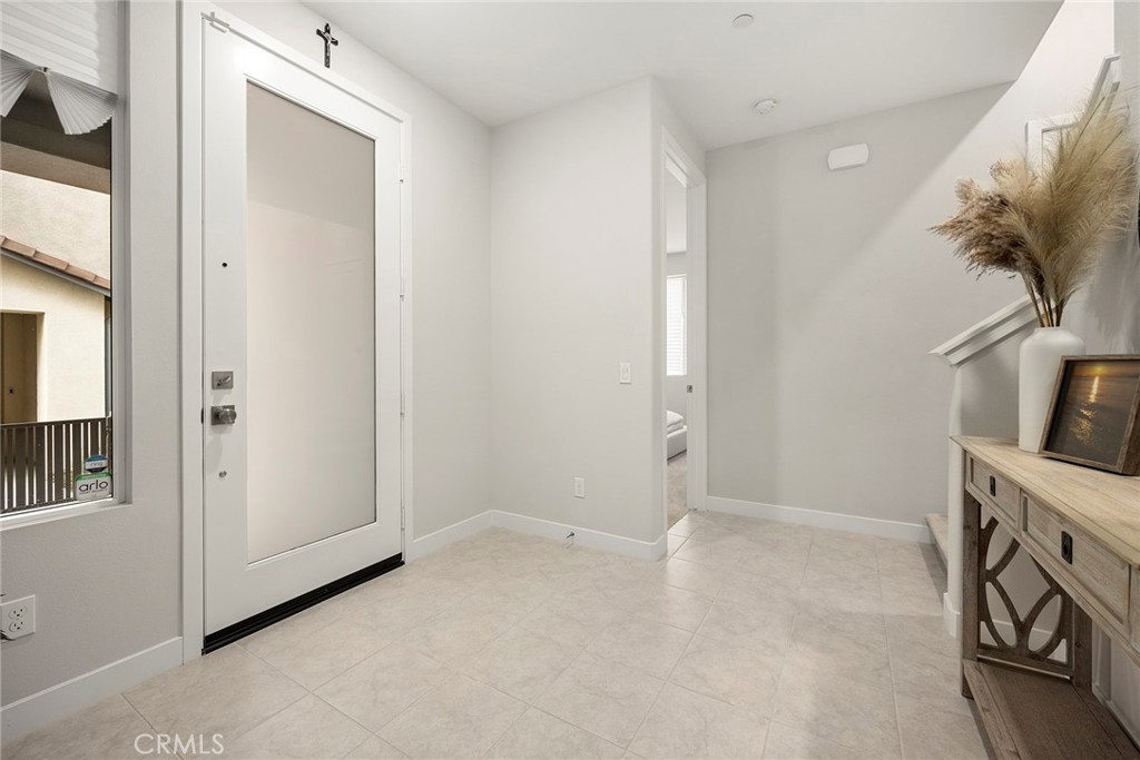 125 Pattern Irvine, CA 92618 - Photo 7 of 38 an empty room with a fireplace and a window