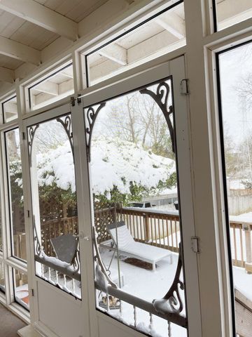 a view of a livingroom with a ceiling fan and window