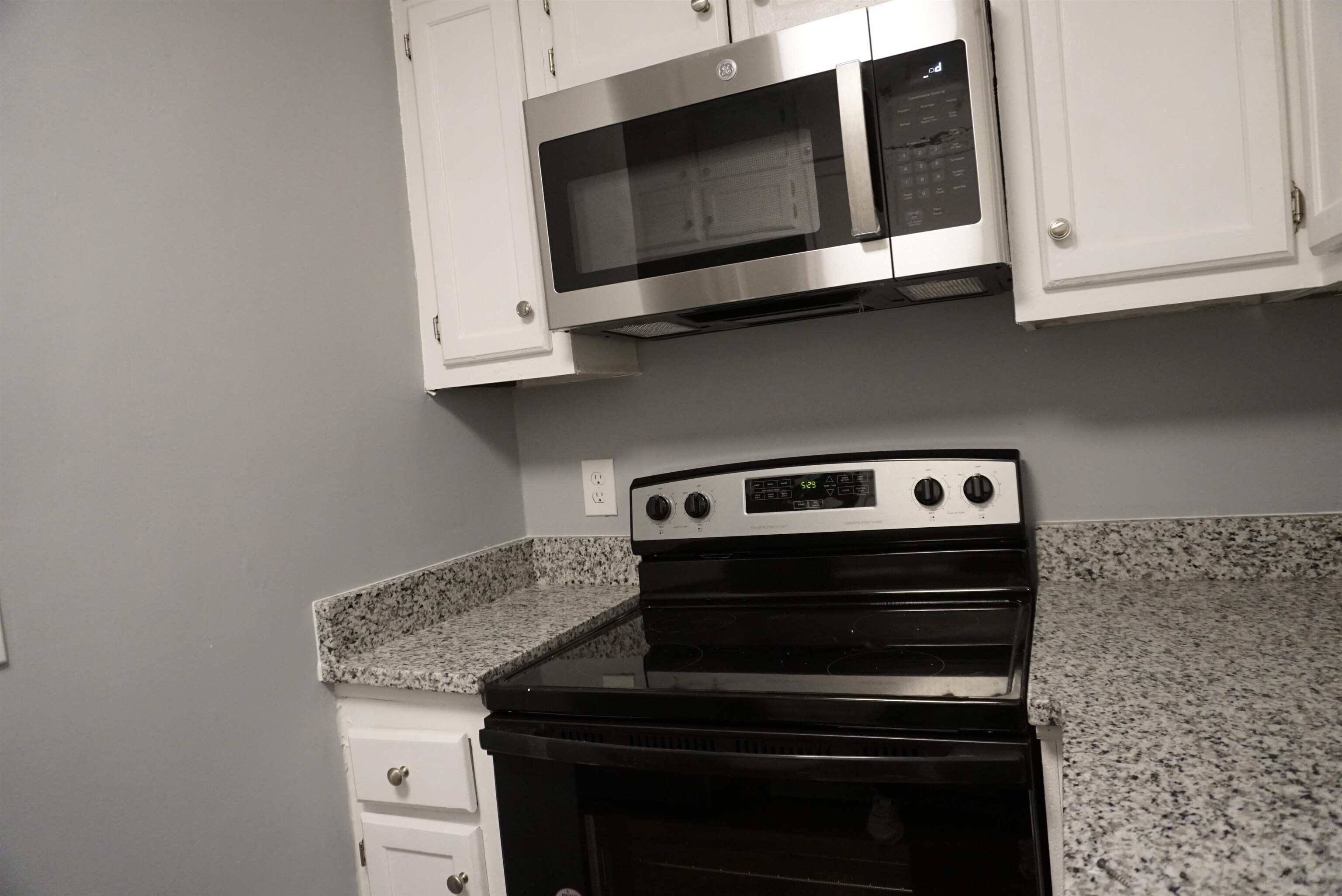5489 South Park Place Atlanta, GA 30349 - Photo 12 of 37 a stove top oven sitting inside of a kitchen