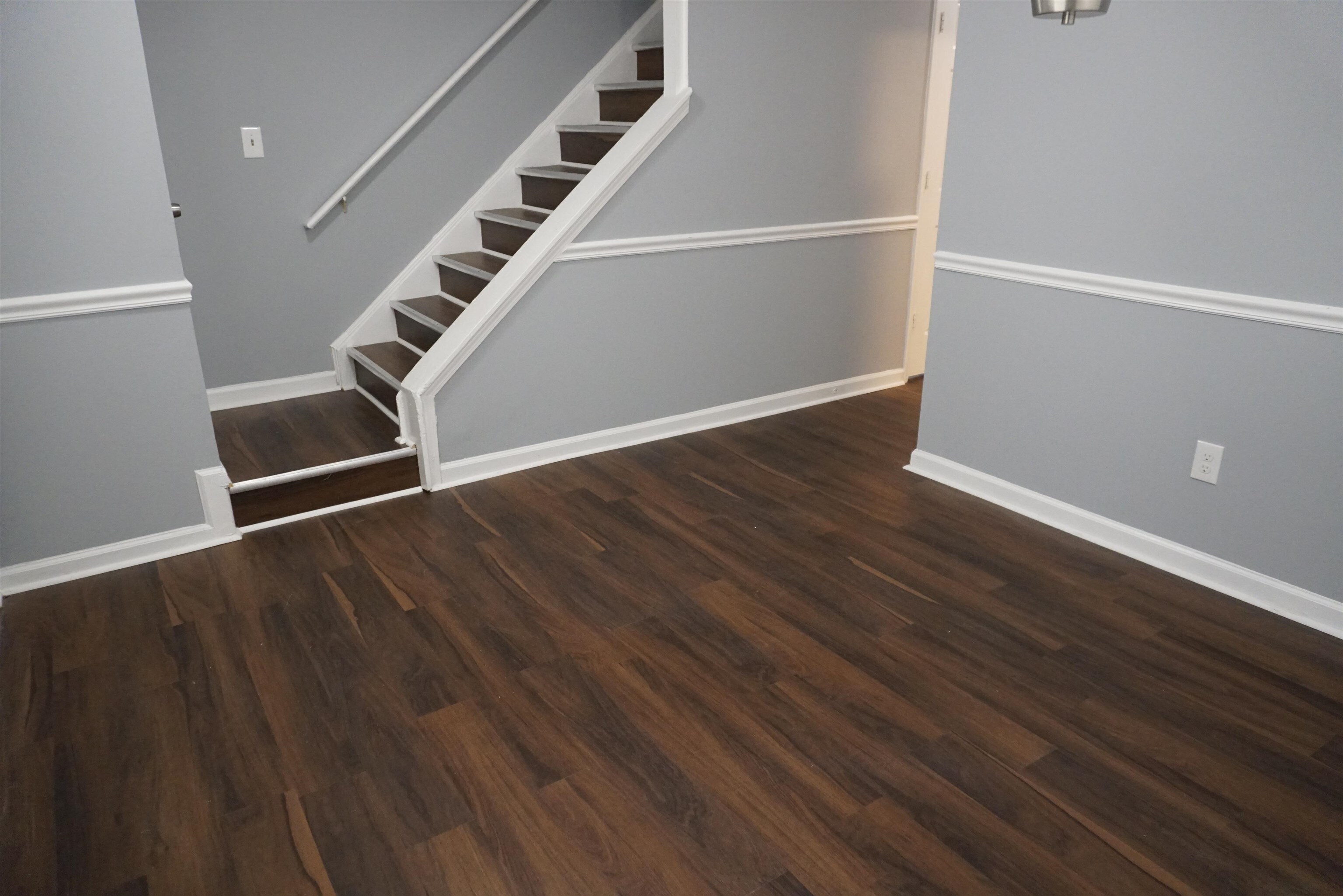 5489 South Park Place Atlanta, GA 30349 - Photo 20 of 37 a view of an empty room with wooden floor and stairs
