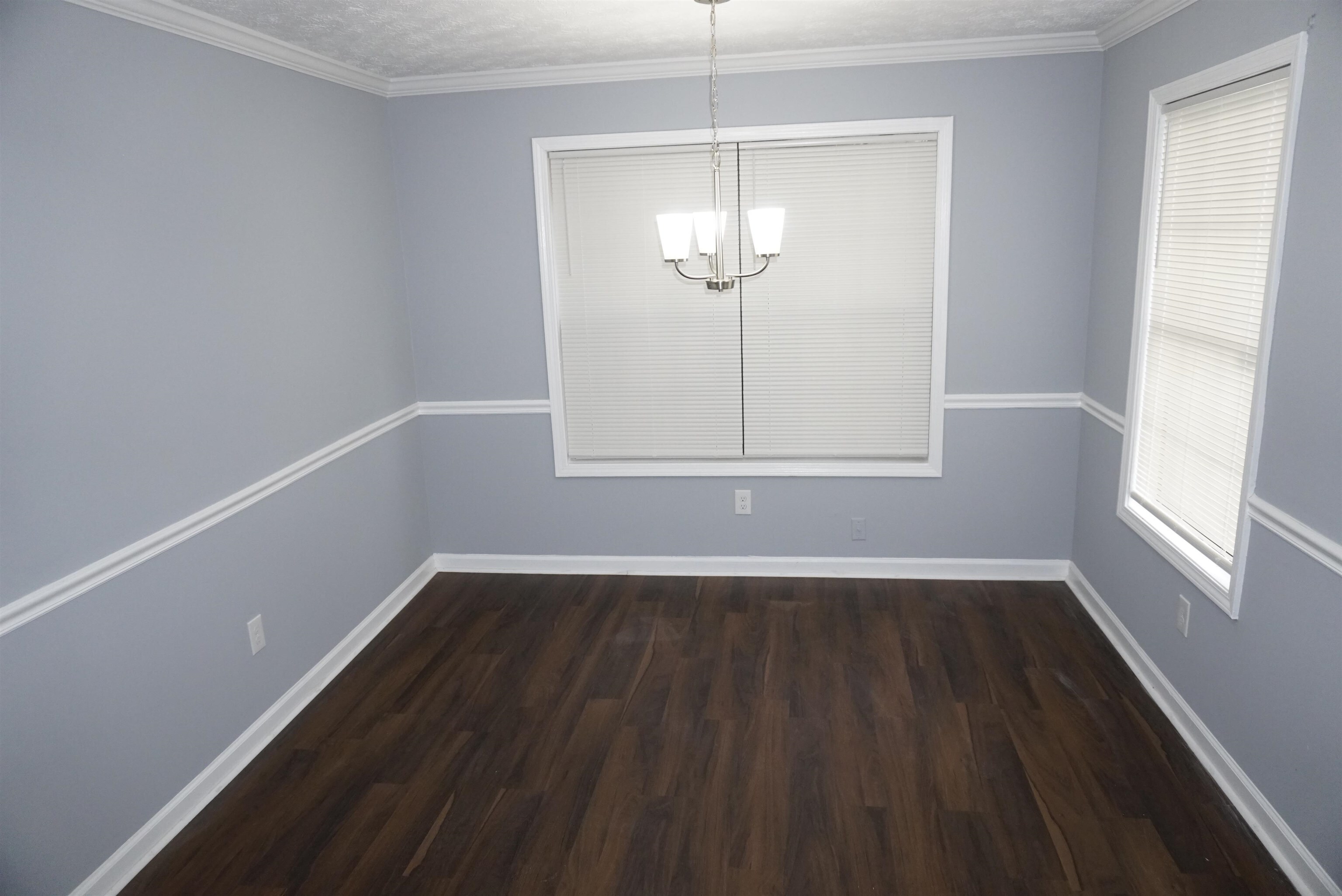 5489 South Park Place Atlanta, GA 30349 - Photo 3 of 37 an empty room with wooden floor fan and window