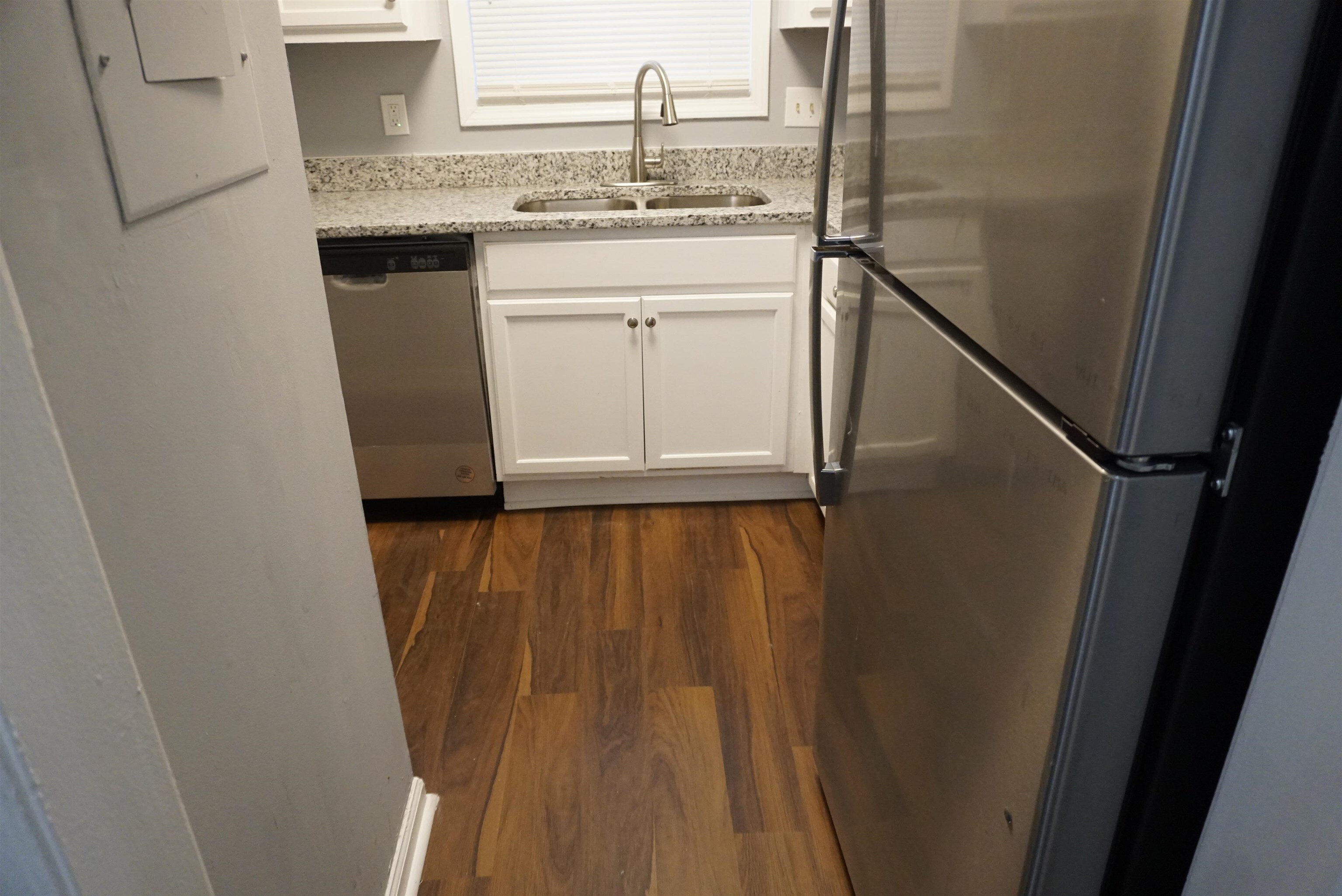 5489 South Park Place Atlanta, GA 30349 - Photo 9 of 37 a bathroom with a sink and mirror