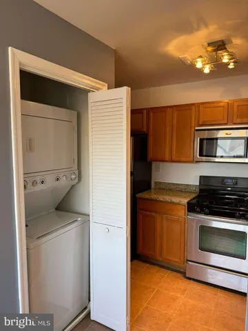 a kitchen with a stove and a microwave