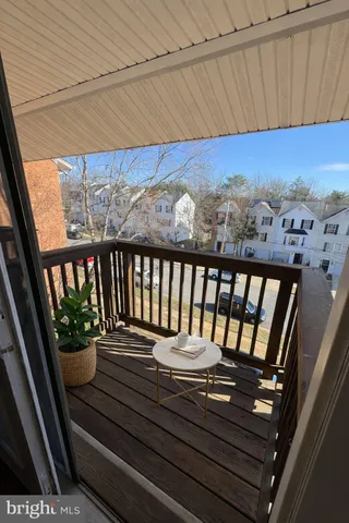 a view of a balcony with wooden floor
